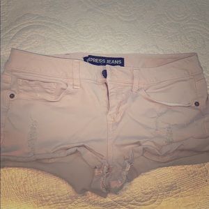Ripped pink shorts